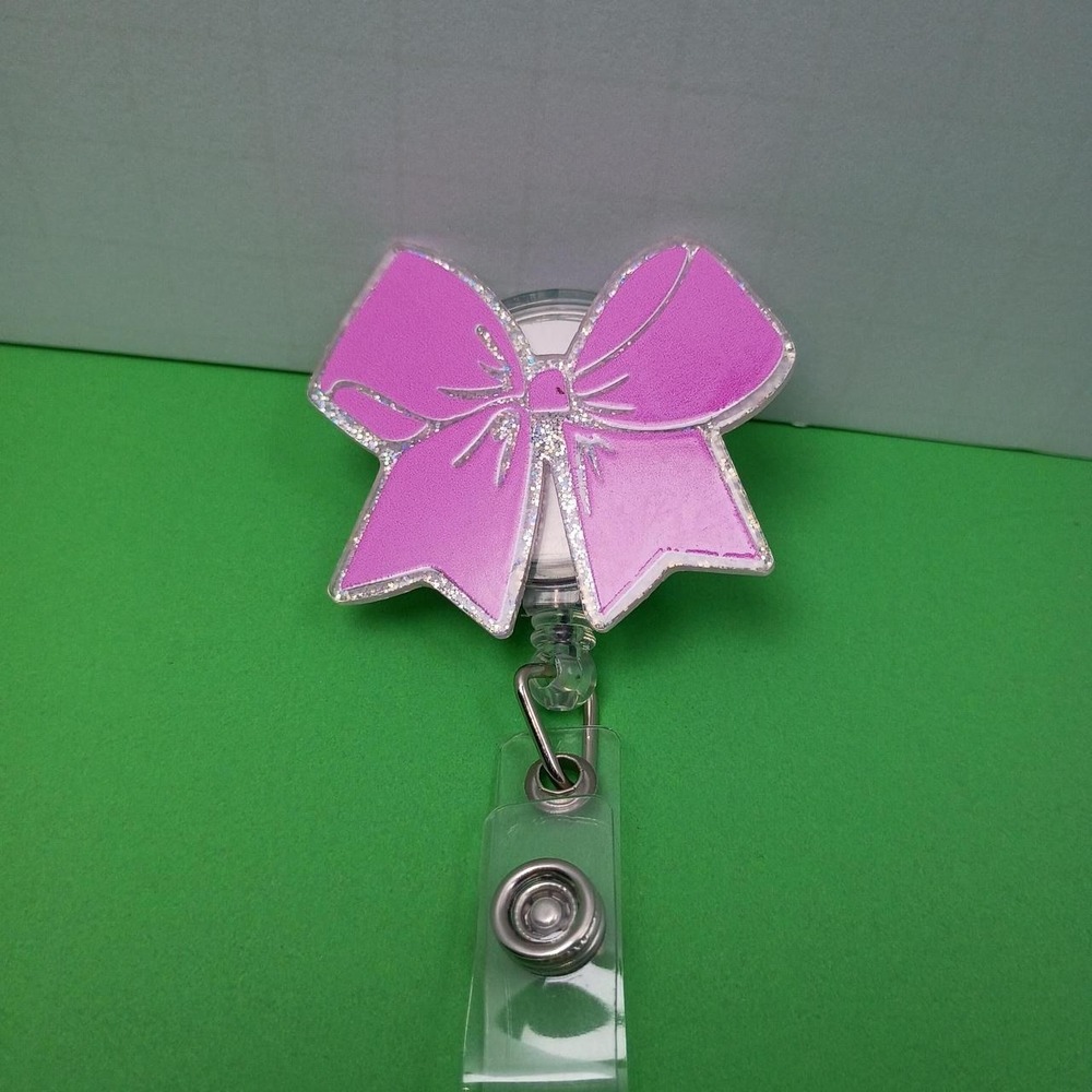 Pink glitter bow badge reel